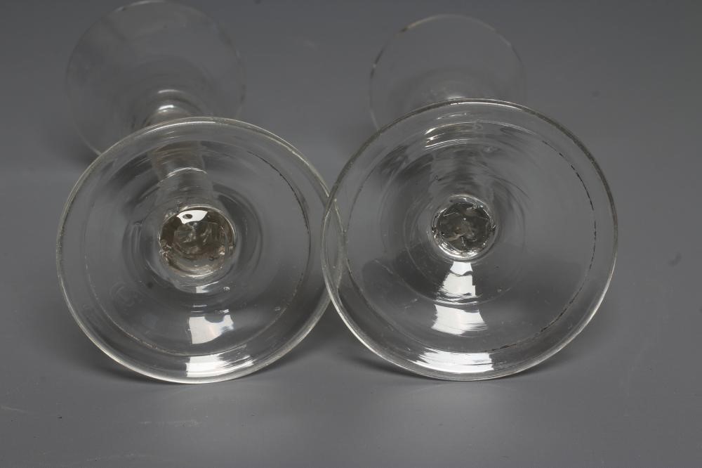 THREE GEORGIAN CORDIAL GLASSES comprising a round funnel bowl on plain cylindrical stem and folded Image