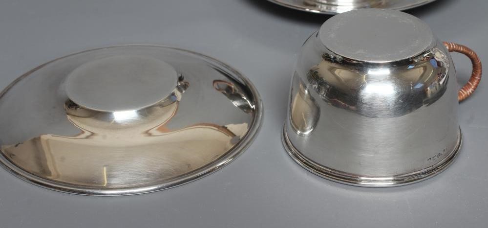 A PAIR OF GEORGE V SILVER TEA CUPS AND SAUCERS by William Devonport Image