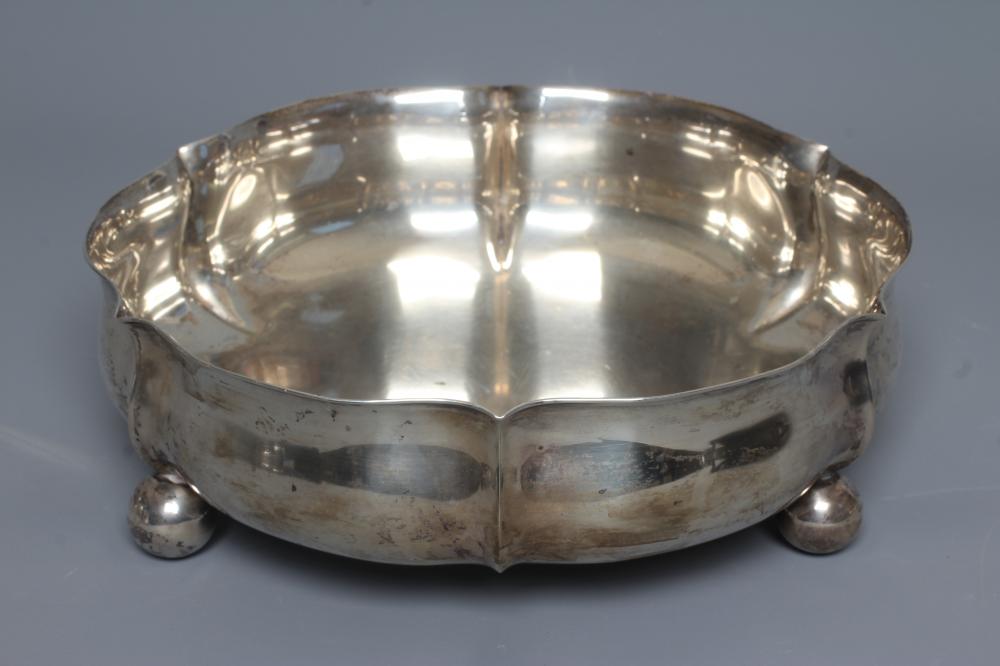 A GERMAN SHALLOW BOWL by Wilhelm T Binder, stamped 800, of lobed squat baluster form raised upon Image