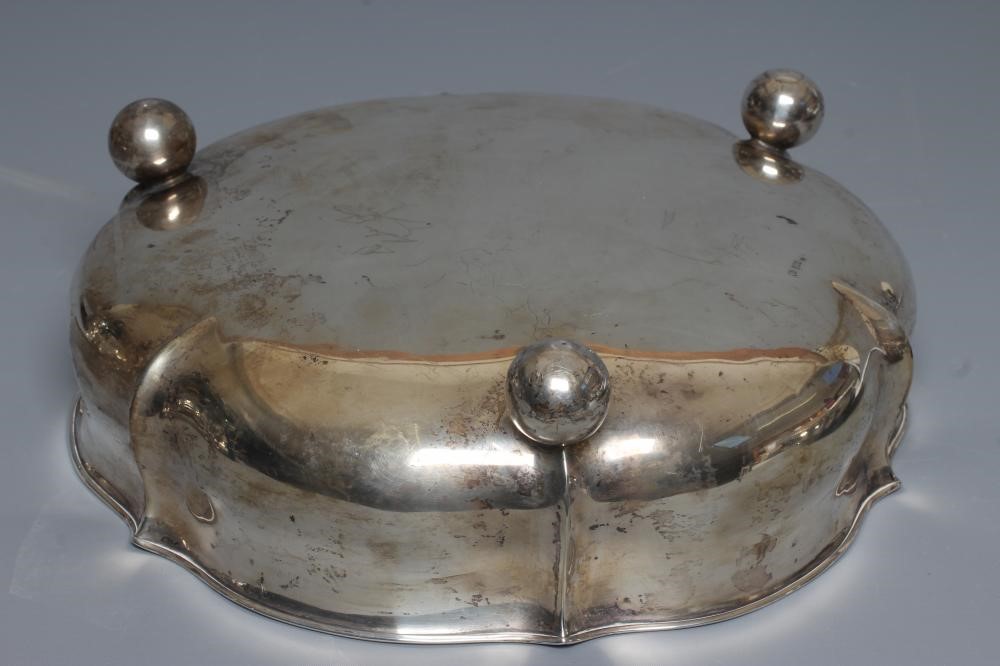 A GERMAN SHALLOW BOWL by Wilhelm T Binder, stamped 800, of lobed squat baluster form raised upon Image