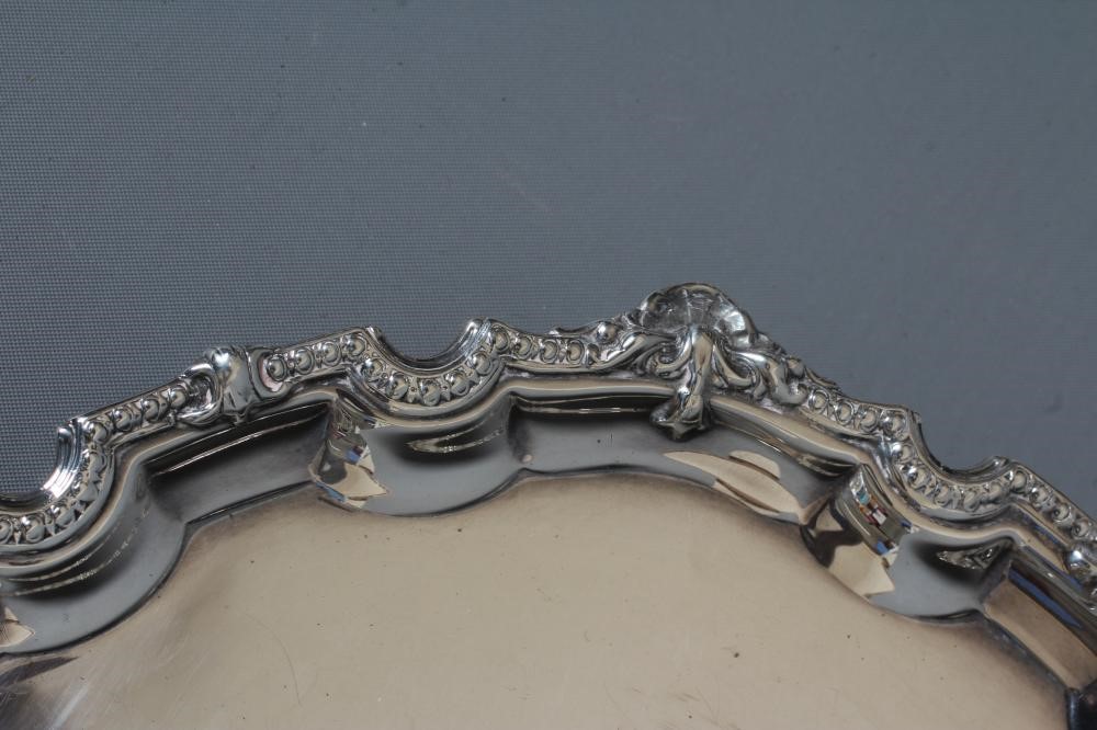 AN ELIZABETH II SILVER SMALL SALVER by Mappin & Webb Image