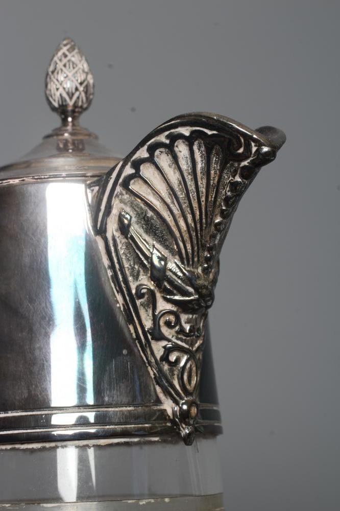 AN ELIZABETH II SILVER MOUNTED GLASS CLARET JUG of swept cylindrical form Image