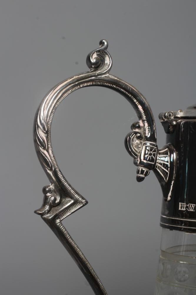 AN ELIZABETH II SILVER MOUNTED GLASS CLARET JUG of swept cylindrical form Image