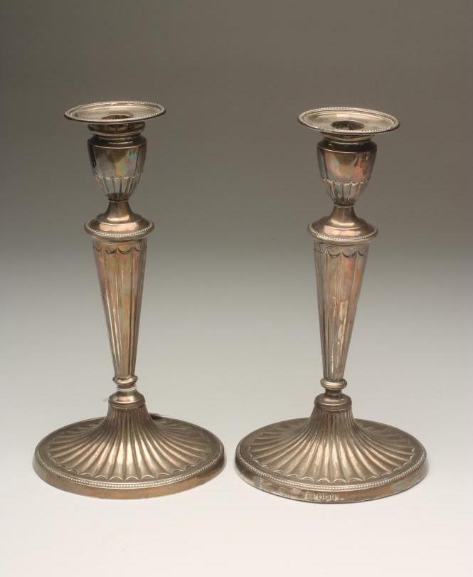 A PAIR OF LATE VICTORIAN SILVER CANDLESTICKS Image