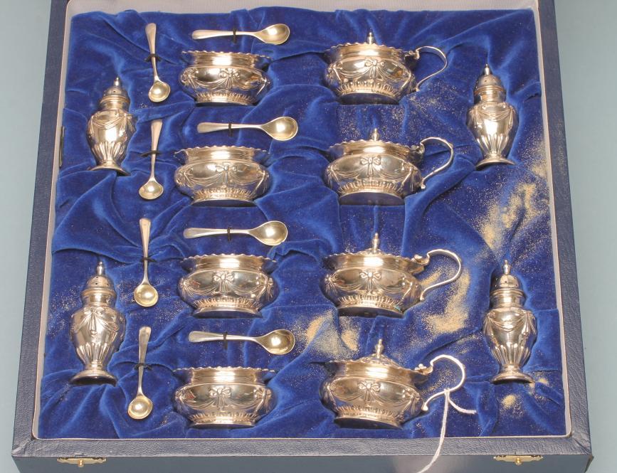 AN EDWARDIAN SILVER TWELVE PIECE CRUET Image