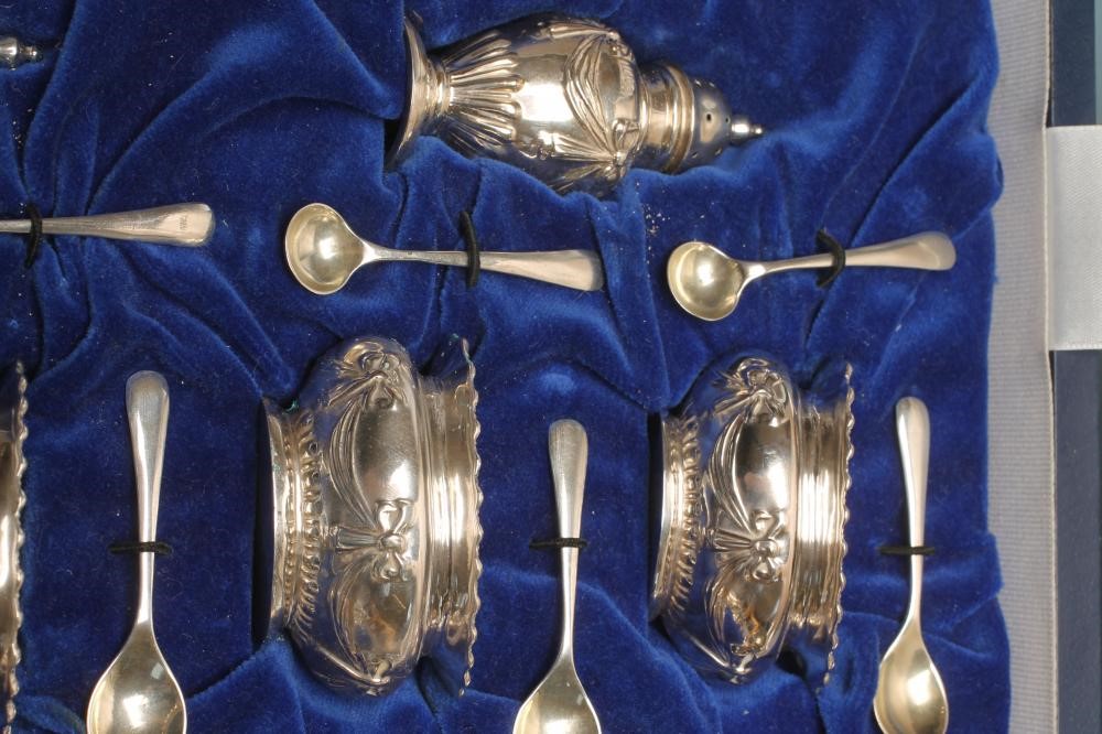 AN EDWARDIAN SILVER TWELVE PIECE CRUET Image