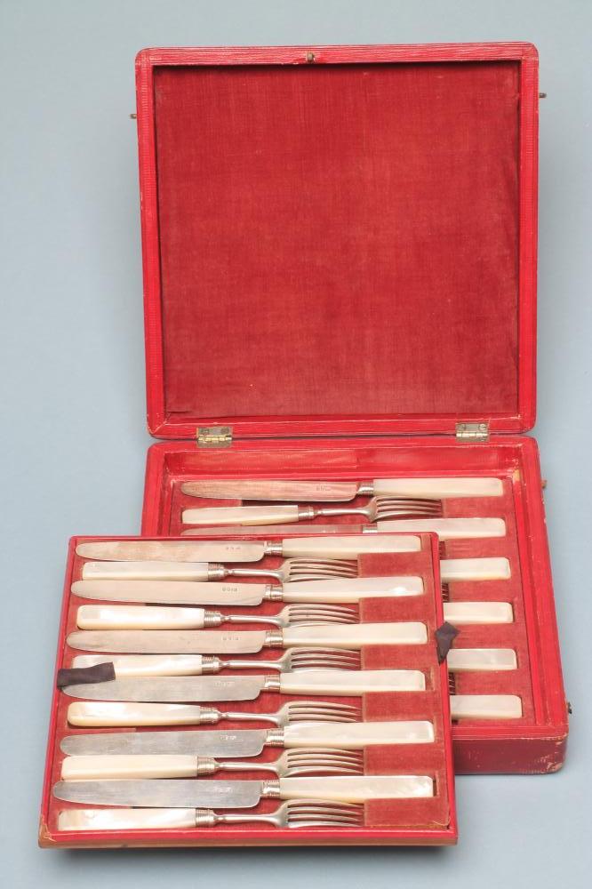 A SET OF TWELVE LATE GEORGE III SILVER DESSERT KNIVES AND FORKS Image