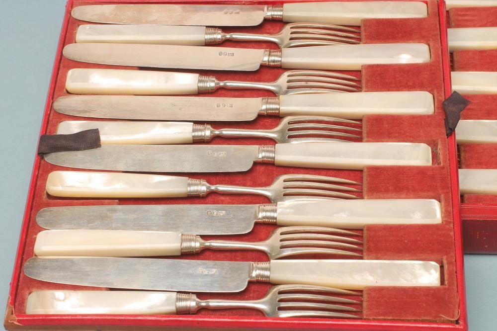 A SET OF TWELVE LATE GEORGE III SILVER DESSERT KNIVES AND FORKS Image