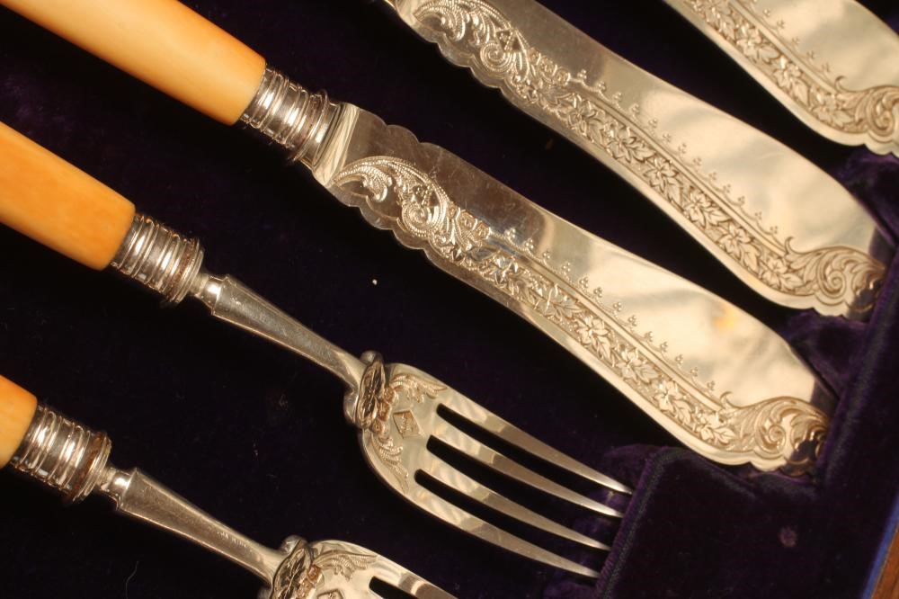 A SET OF SIX LATE VICTORIAN SILVER FRUIT KNIVES AND FORKS Image