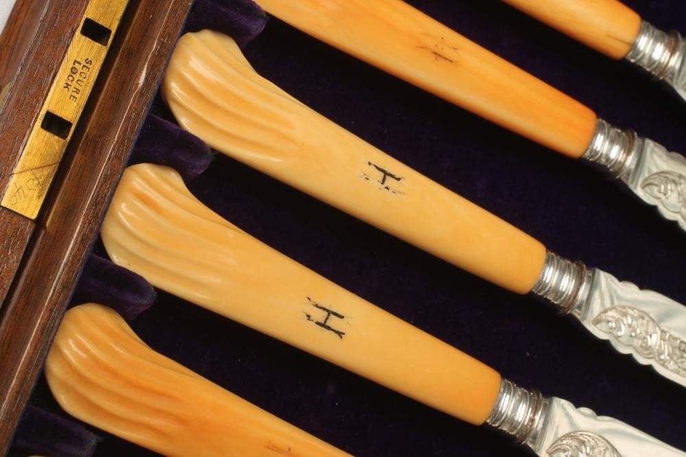 A SET OF SIX LATE VICTORIAN SILVER FRUIT KNIVES AND FORKS Image