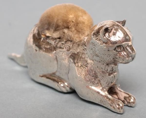 AN EDWARDIAN NOVELTY SILVER PIN CUSHION Image