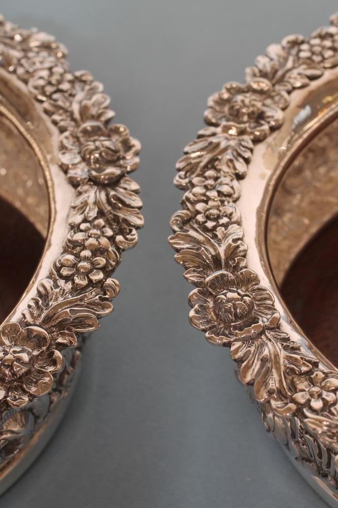 A PAIR OF EARLY VICTORIAN SILVER DECANTER COASTERS Image