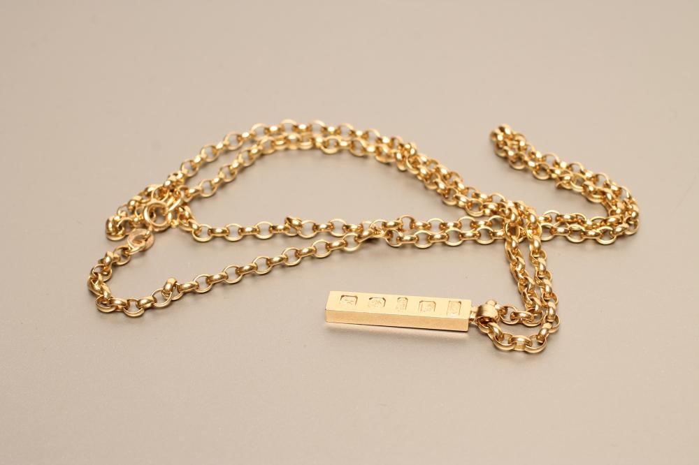 A 9CT GOLD INGOT PENDANT Image