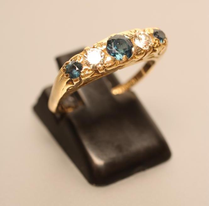 A SAPPHIRE AND DIAMOND RING Image