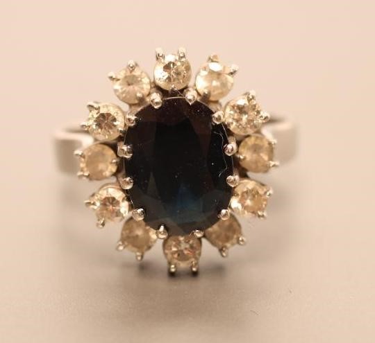 A SAPPHIRE AND DIAMOND CLUSTER RING Image