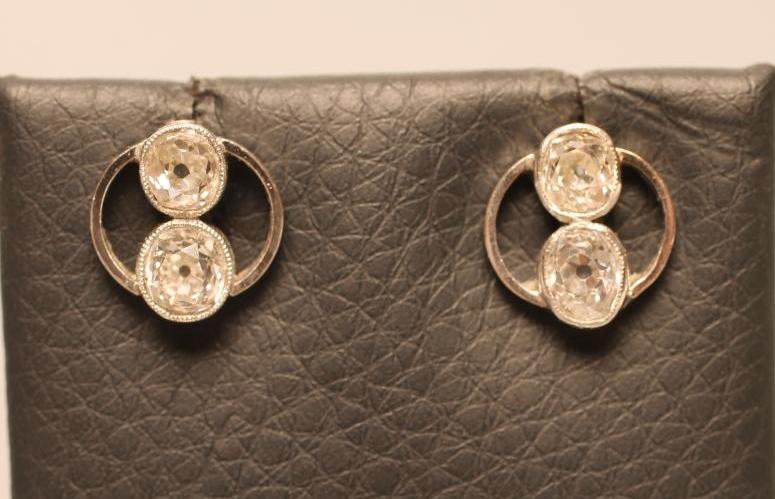 A PAIR OF DIAMOND EAR STUDS Image