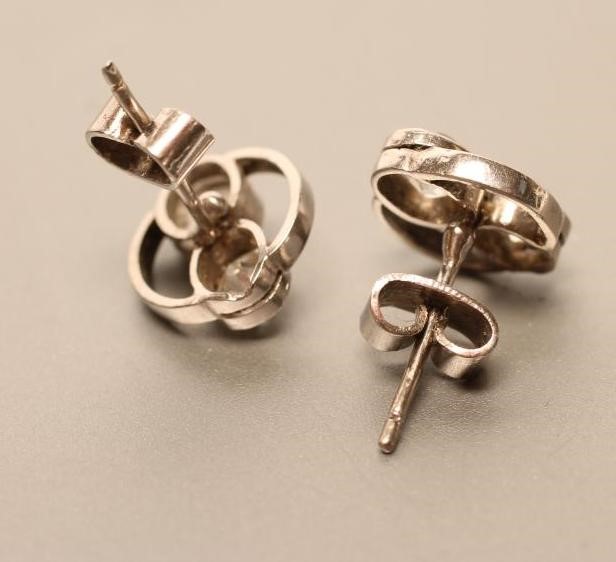 A PAIR OF DIAMOND EAR STUDS Image