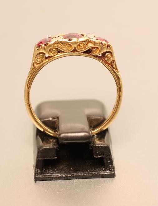 A THREE STONE RUBY RING Image