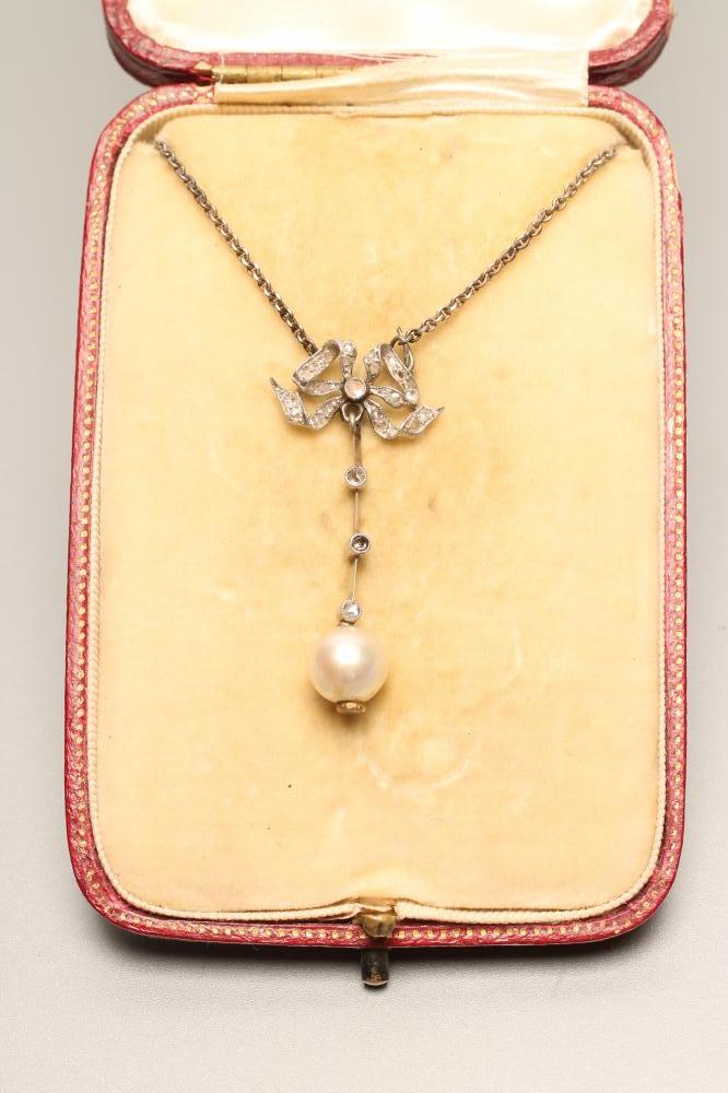 AN EDWARDIAN DIAMOND AND PEARL DROP PENDANT Image