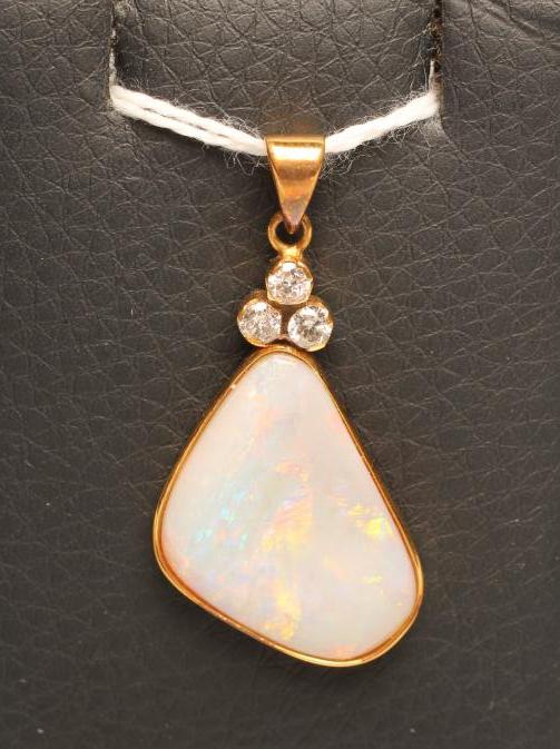 A MODERN OPAL AND DIAMOND PENDANT Image