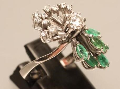 AN EMERALD AND DIAMOND COCKTAIL RING Image