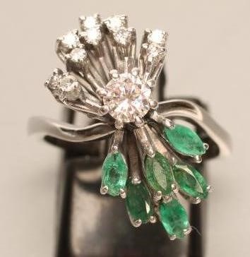AN EMERALD AND DIAMOND COCKTAIL RING Image