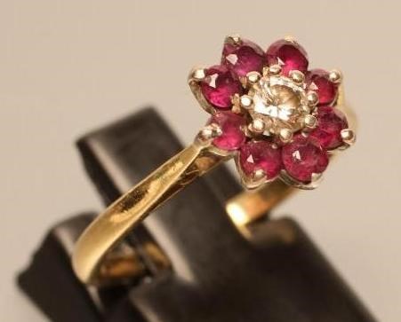 A RUBY AND DIAMOND CLUSTER RING Image