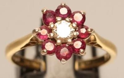 A RUBY AND DIAMOND CLUSTER RING Image