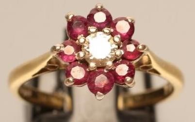 A RUBY AND DIAMOND CLUSTER RING Image