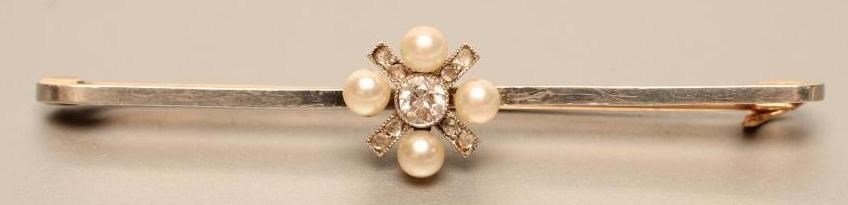 A LATE VICTORIAN BAR BROOCH centred by a diamond and cultured pearl cross panel Image