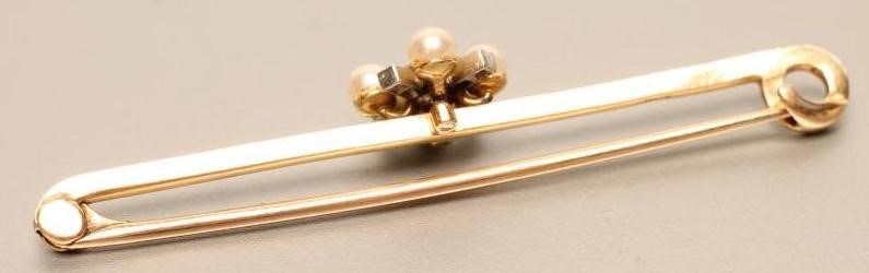 A LATE VICTORIAN BAR BROOCH centred by a diamond and cultured pearl cross panel Image