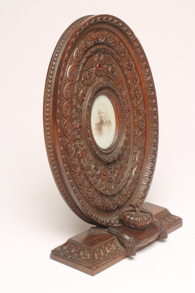 A VICTORIAN OAK FREE-STANDING OVAL FRAME Image