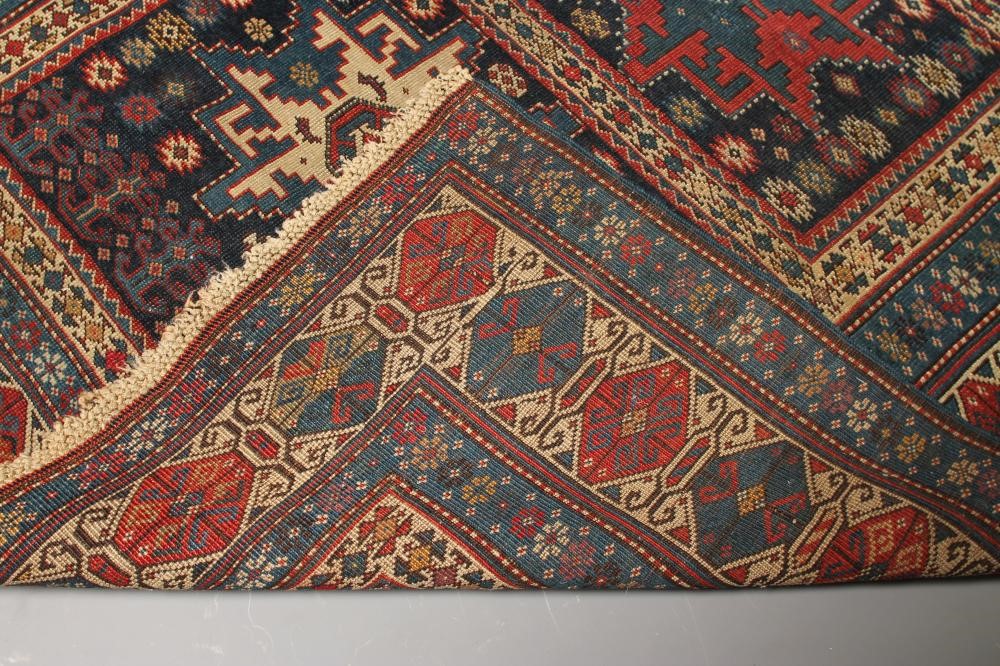 A CAUCASIAN KUBA TRIBAL RUG in navy blue and ivory Image