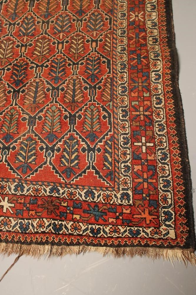 A PERSIAN TRIBAL RUG Image