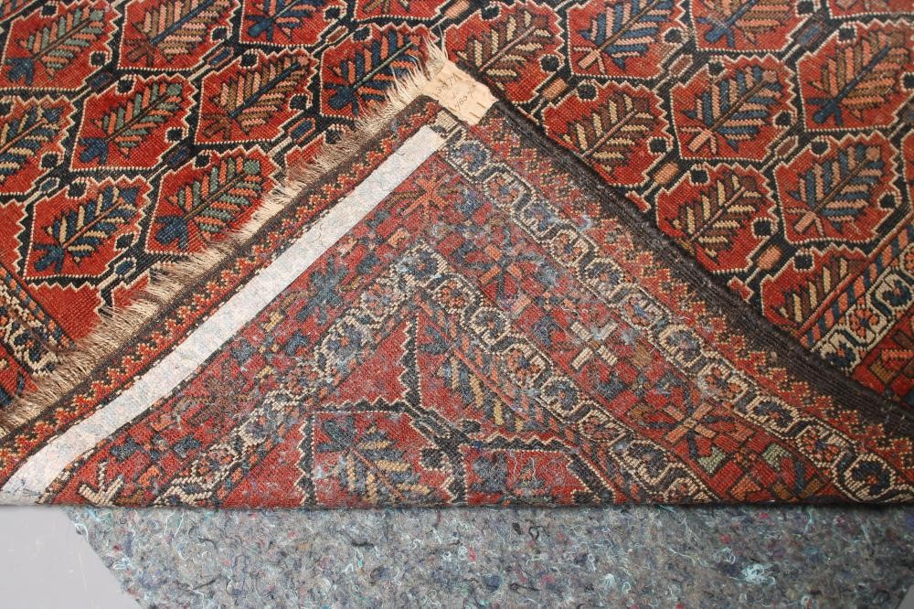 A PERSIAN TRIBAL RUG Image