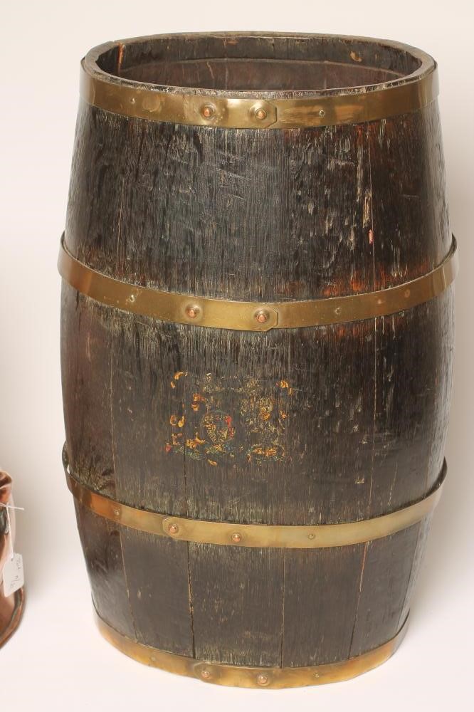A COOPERED OAK OVAL BARREL STICK STAND with brass banding and remnants of Royal Coat of Arms Image