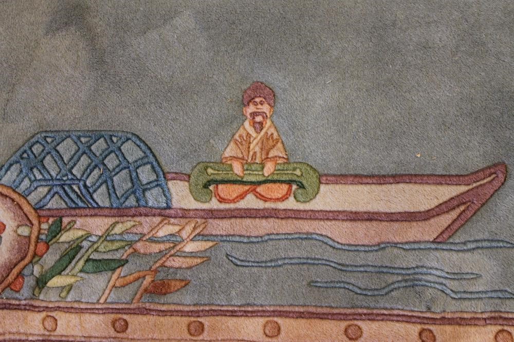 A CHINESE PICTORIAL WASHED AND FRINGED SILK RUG Image