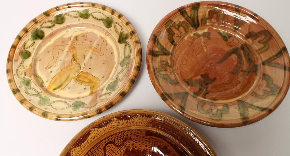 THREE STUDIO TERRACOTTA CHARGERS of plain dished circular form with scraffito type decoration of a Image
