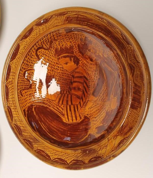 THREE STUDIO TERRACOTTA CHARGERS of plain dished circular form with scraffito type decoration of a Image