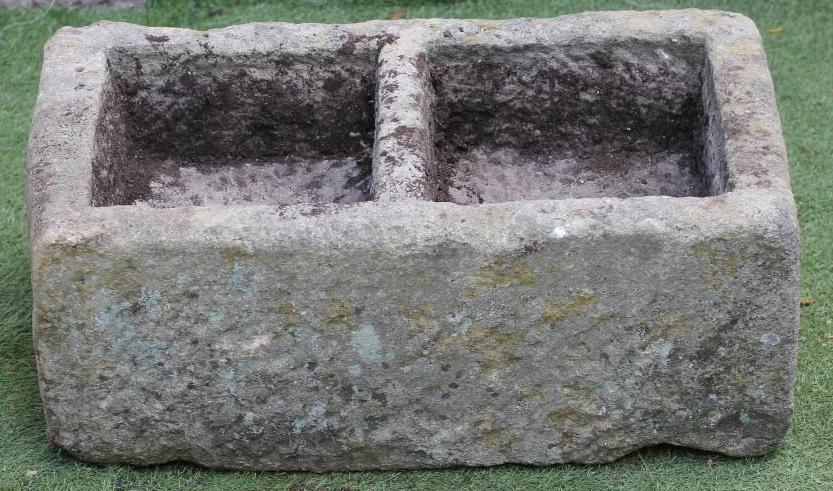 A SANDSTONE URN of well cut oblong form Image