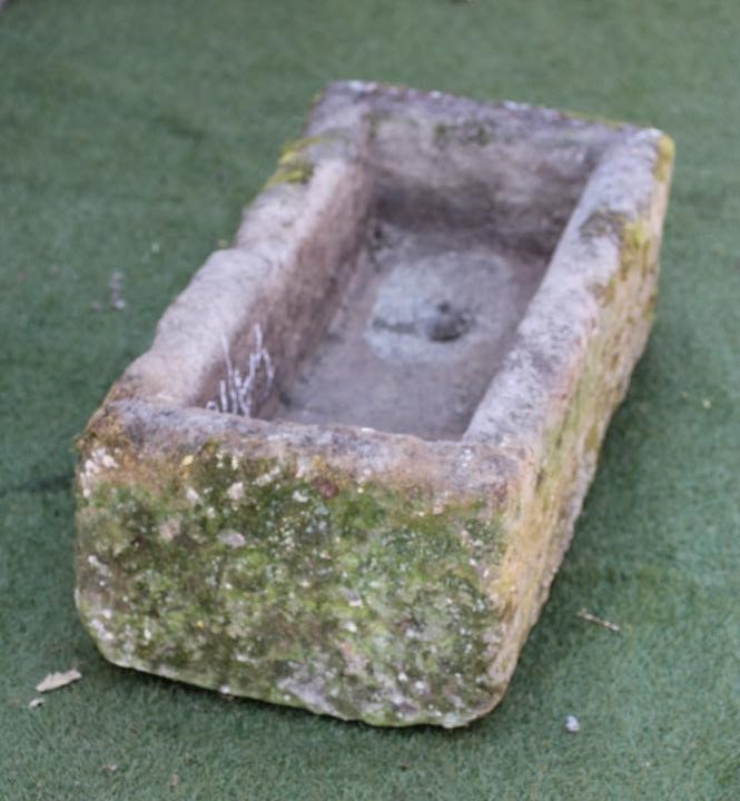 A SANDSTONE TROUGH of rough hewn oblong form Image