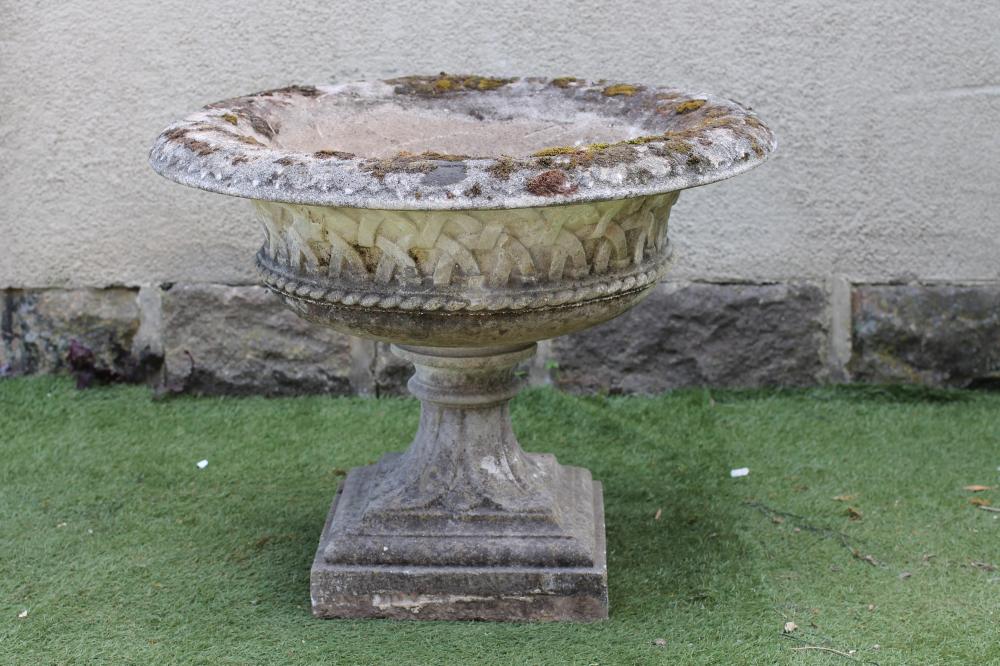 A LARGE TRELLIS MOULDED COMPOSITION STONE URN Image