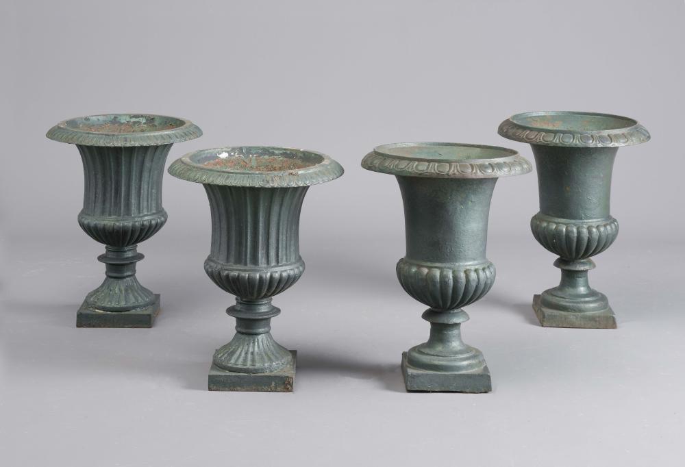 A SET OF FOUR CAST IRON URNS of fluted campana form with ovolu moulded rim Image