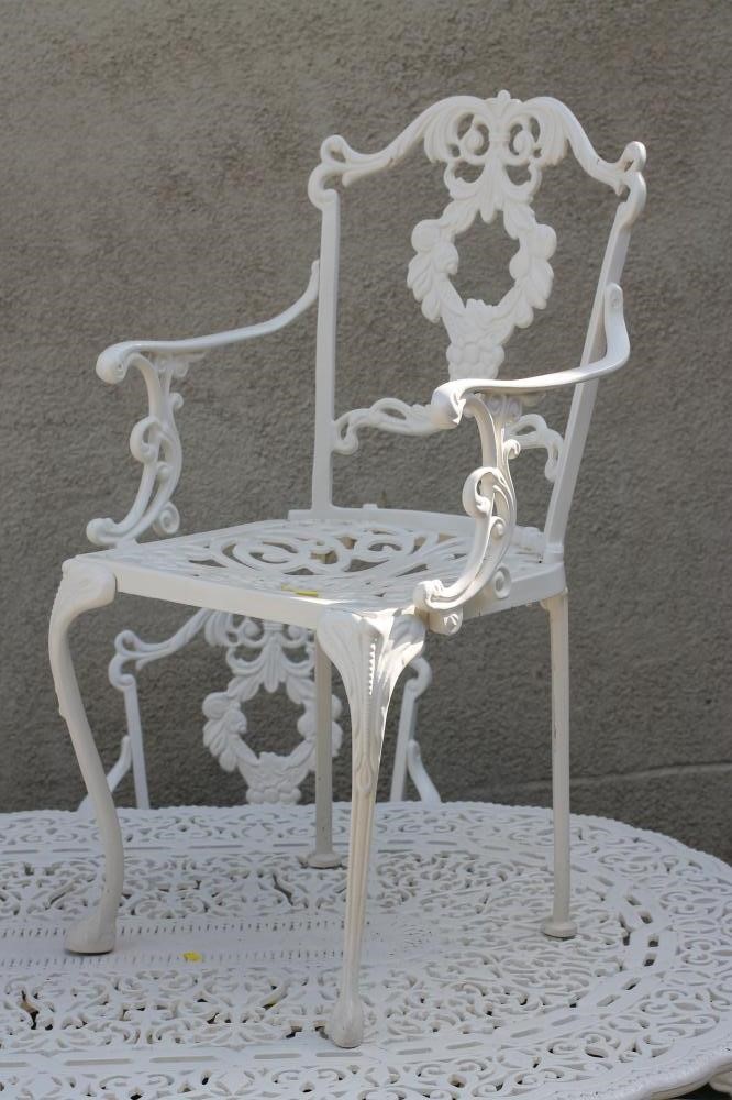 A SEVEN PIECE CAST METAL GARDEN SET Image