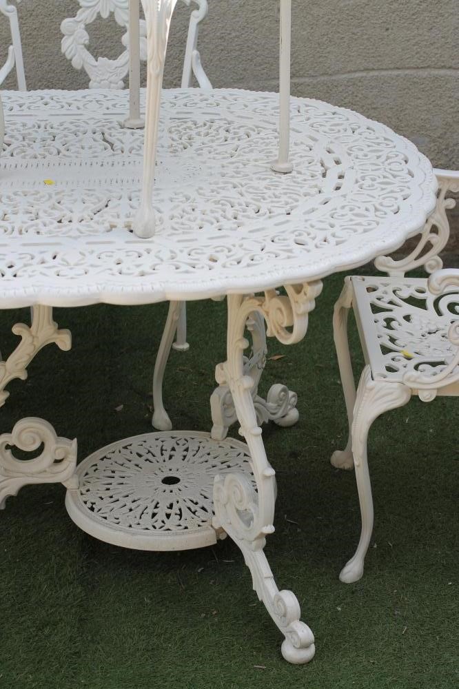 A SEVEN PIECE CAST METAL GARDEN SET Image