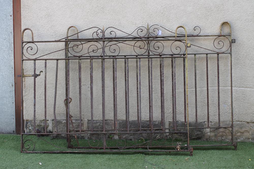 A PAIR OF CAST IRON VEHICULAR ENTRANCE GATES Image