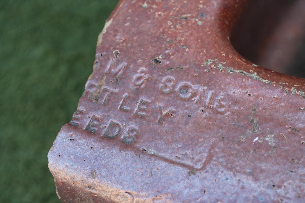 A SALTGLAZE STONEWARE TROUGH of quadrant form with moulded rim Image