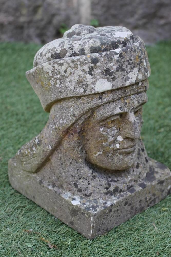 A CARVED SANDSTONE BUST of a Renaissance man wearing a hat Image