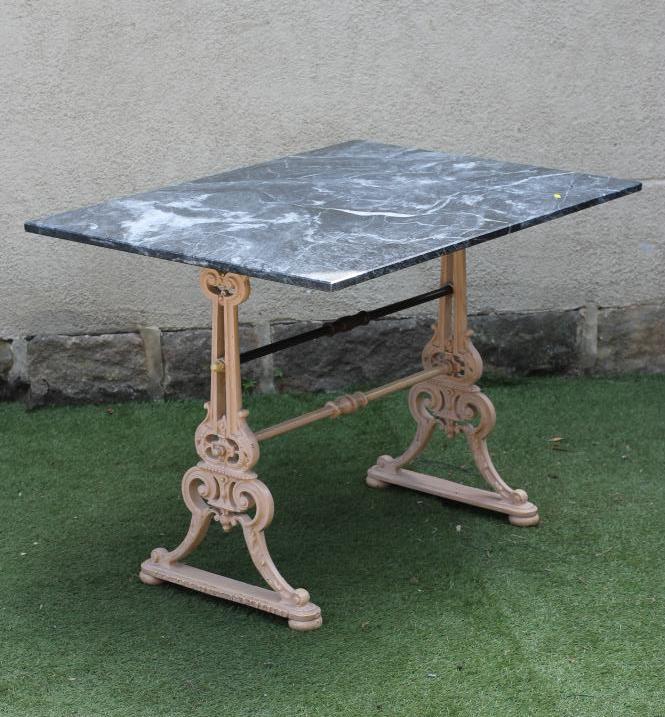 A GARDEN TABLE comprising a veined grey marble top on a Victorian cast iron base Image