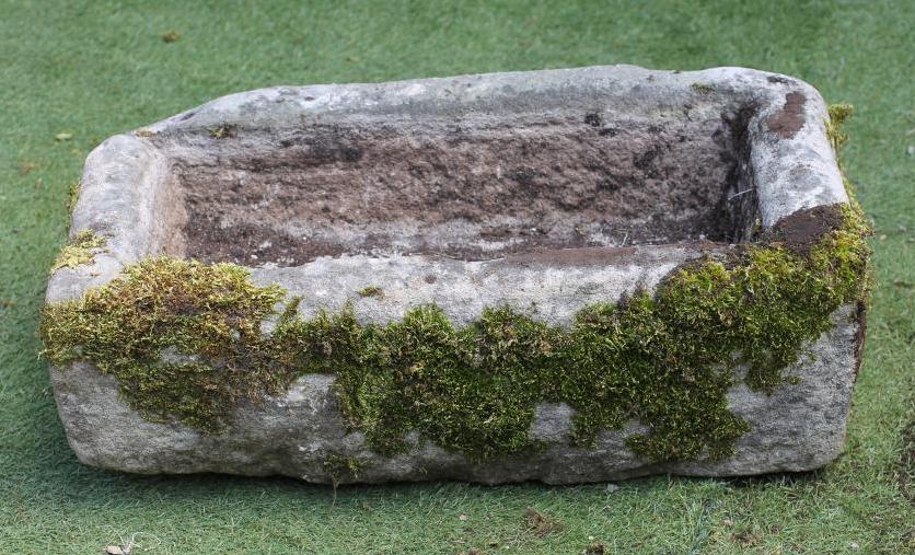 A SANDSTONE TROUGH of rough hewn oblong form Image